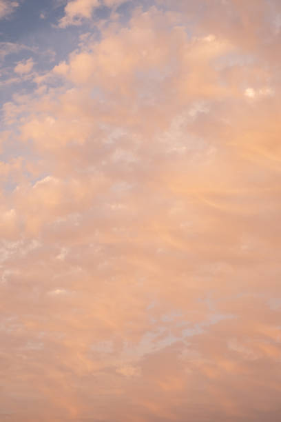 istock Majestic cloudy sunset at dusk dramatic skyscape. Abstract background with Amazing clouds with orange light of nature 1425232414