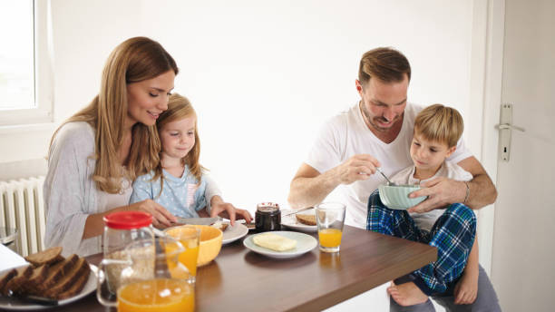 istock Parents with their kids in dining room having breakfast together 1425232453