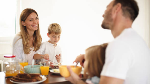 istock Parents with their kids in dining room having breakfast together 1425232474
