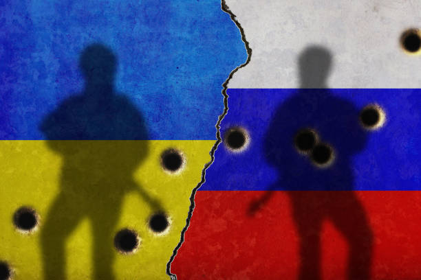 istock Russia vs Ukraine flag on cracked wall 1425236788