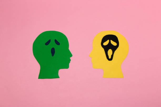istock green and yellow head on pink background with ghost face brain, flat lay, creative halloween concept, possessed heads 1425237827
