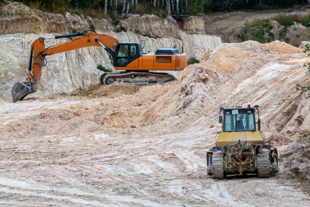istock Excavator and bulldozer in clay quarry 1425238063
