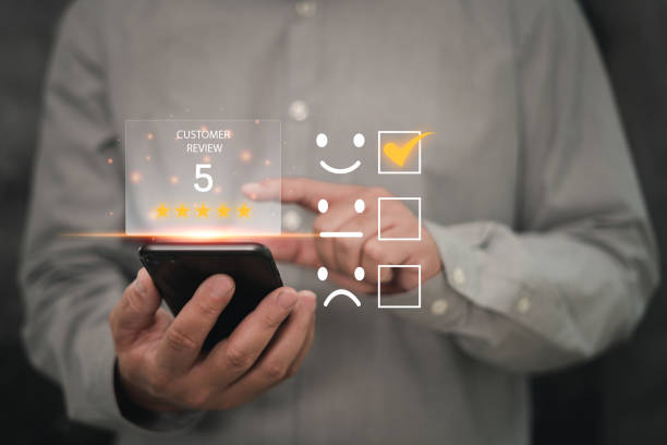 istock Customer satisfaction feedback survey and rating to service experience online application, Business people Satisfaction Rating score on virtual screen the happy Smile icon with smartphone 1425239196