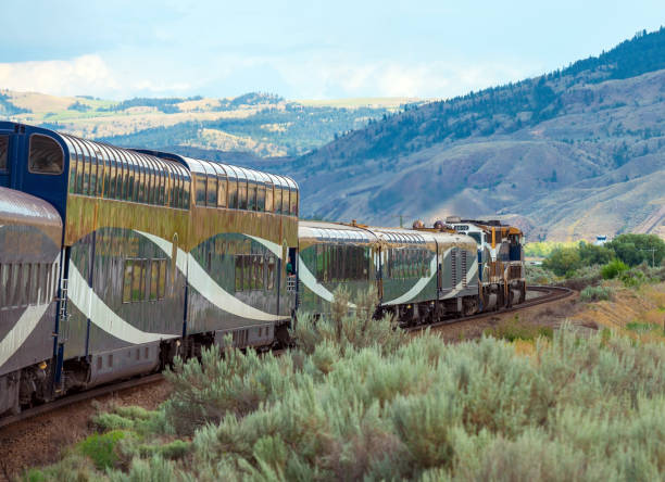 Rocky Mountaineer Train, Kamloops, Canada Rocky mountaineer locomotive with gold and silver leaf train wagons near Kamloops, British Columbia, Canada. kamloops stock pictures, royalty-free photos & images