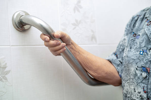 istock Asian senior or elderly old lady woman patient use slope walkway handle security with help support assistant in nursing hospital ward; healthy strong medical concept. 1425241117