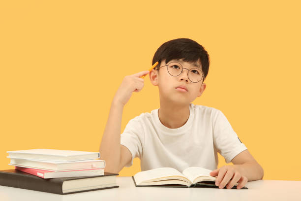 istock Student thinking carefully, concentrating and studying hard at desk 1425241715