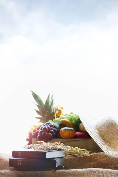 istock Thanksgiving fruit decoration with bible and harvest crop background 1425242521