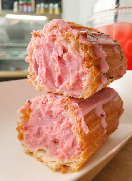 istock close-up half of eclair with pink lavender cream 1425242746