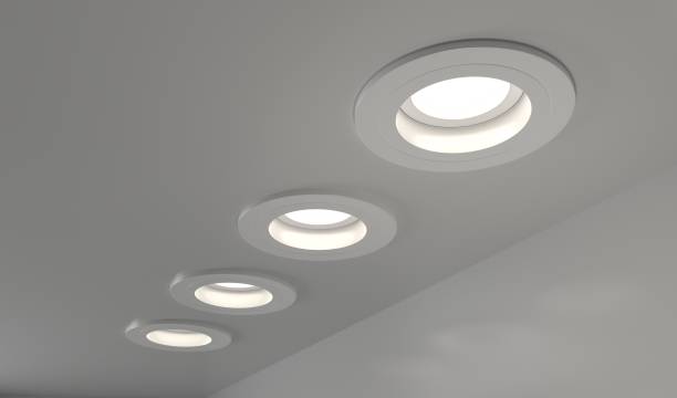 spots encastrés plafond rendu 3d. chambre intérieure réaliste avec des downlights ronds et lumineux la nuit. éclairage artificiel, lampes led pour la maison ou le bureau sur fond sombre, vue d’angle - récession photos et images de collection