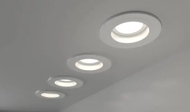 Photo of Spotlights recessed ceiling 3D render. Realistic interior room with round glowing downlights at night. Artificial lighting, LED lamps for home or office on dark background, angle view