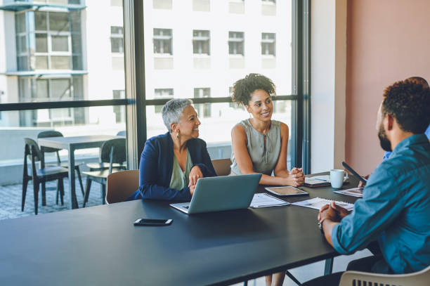 istock Diversity, excited business people and teamwork meeting with laptop technology, kpi data and target audience documents. Smile, happy and motivation collaboration with idea for global company success 1425246888