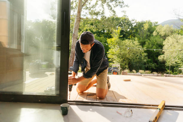 istock Installing wooden decking in front of a cabin house 1425247851