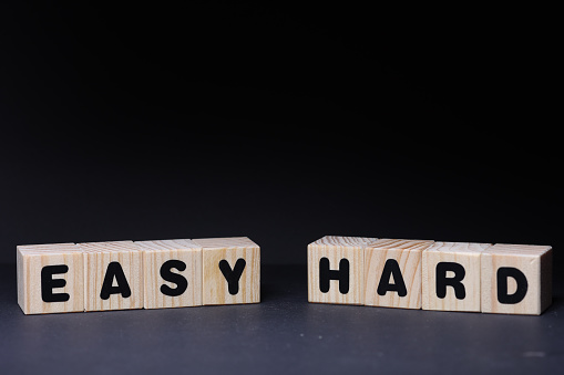 Easy hard sign with wooden cubes