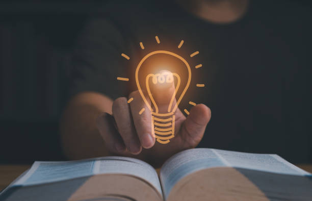 istock Businessman has an good ideas showing as light bulb on hand. 1425247988