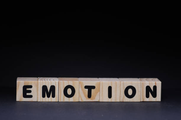 istock Emotion word on wooden cubes on black background 1425248613