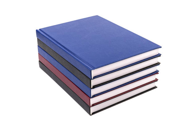 istock Stacked hardcover notebooks on white background. Education business concept. 1425248680