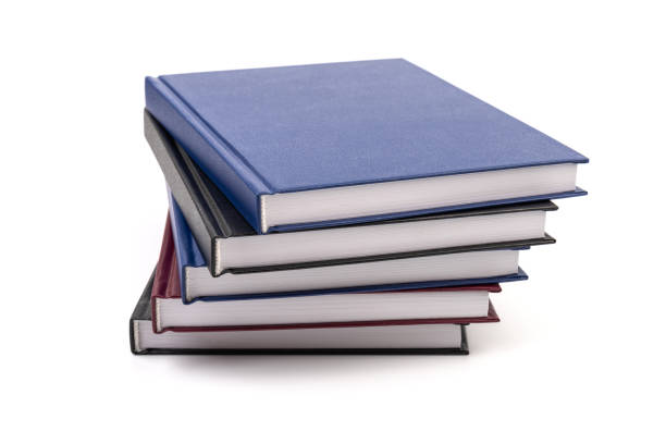 istock Stacked hardcover notebooks on white background. Education business concept. 1425248782