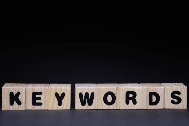 istock Key words word on wooden cubes on black background 1425249093