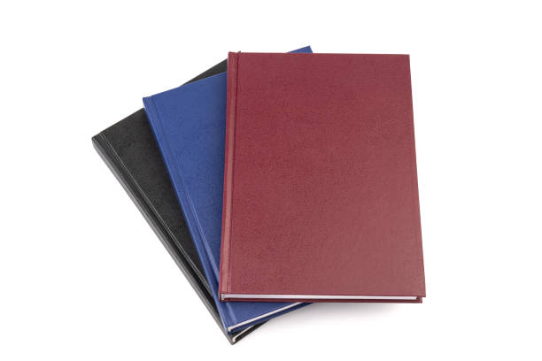 istock Stacked hardcover notebooks on white background. Education business concept. 1425249945