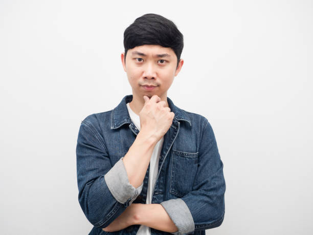 istock Man jeans shirt confident gesture thinking white background 1425250247