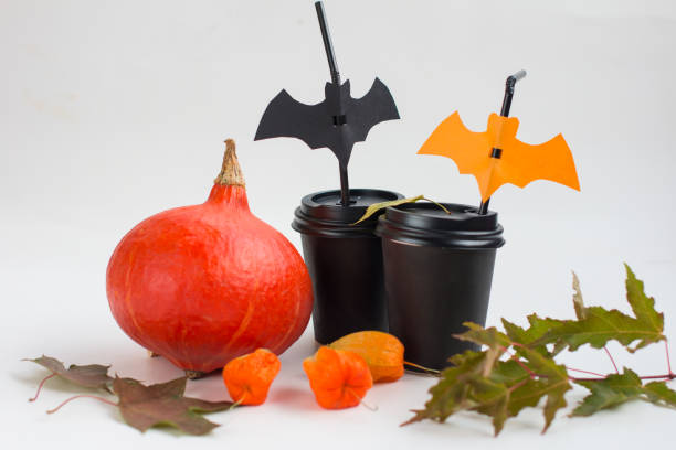 Pumpkin and paper cups with bats. Halloween Decoration