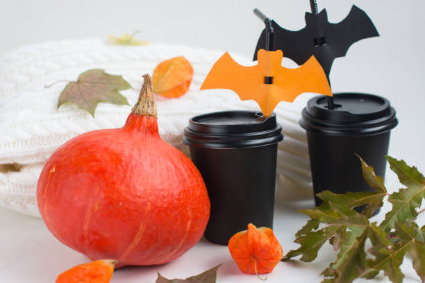 istock Pumpkin and paper cups with bats. Halloween Decoration 1425251106