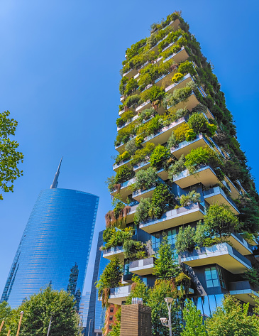 Bosco Verticale in Milan Porta Nuova district also known as Vertical forest buildings. Residential buildings with many trees and other plants in balconies. Ecological green skyscraper