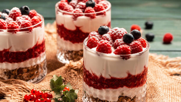 istock Parfait with granola, berries and whipped cream. fresh raspberry dessert, catering, banner menu recipe place for text 1425255057