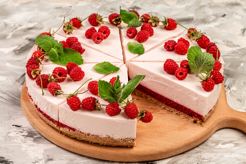 Delicious cheesecake with berries, healthy organic summer dessert pie. snack on a light background, top view.
