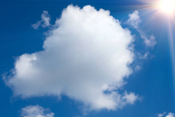 istock Sunny background, blue sky with white clouds and sun 1425255886