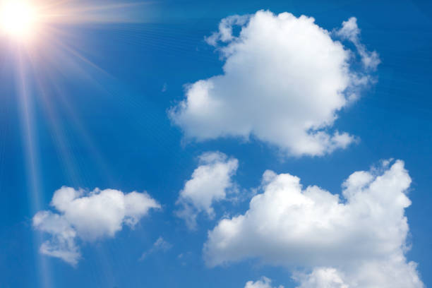 istock Sunny background, blue sky with white clouds and sun 1425256714