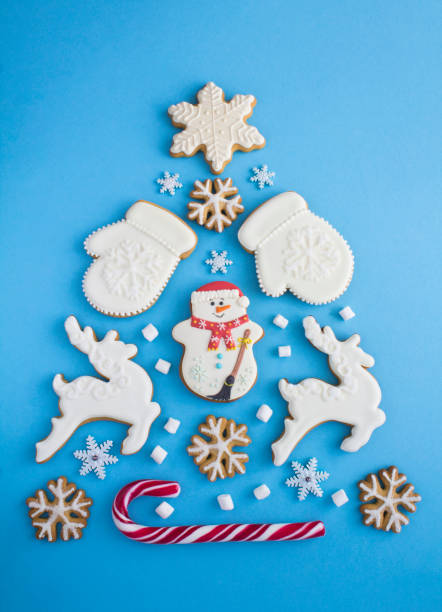 istock Christmas tree from gingerbread on the blue background. Copy space. Top view. 1425261305