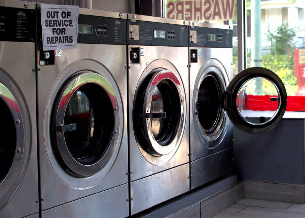 istock Coin operated washing machines in a laundry. 1425261716