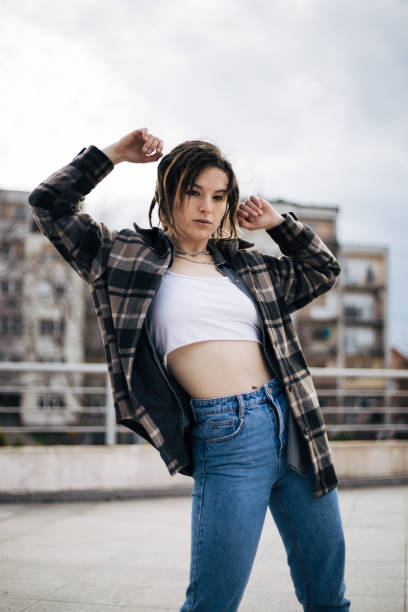 Young girl is dancing on the rooftop
