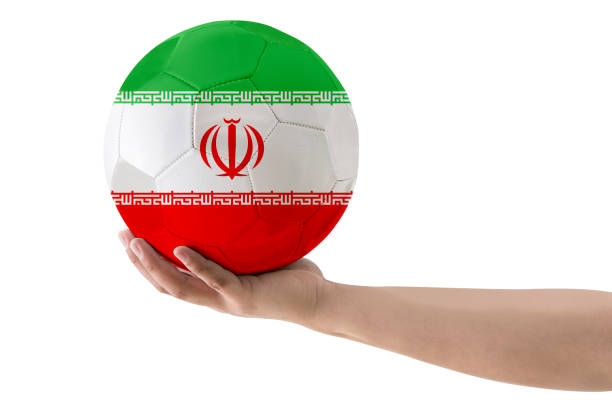 istock MAN'S HAND SOCCER BALL COUNTRIES FLAG 1425266581