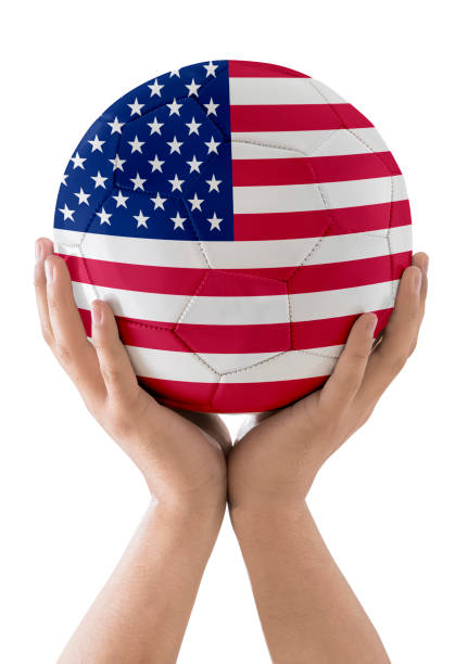 istock MAN'S HAND SOCCER BALL COUNTRIES FLAG 1425267007