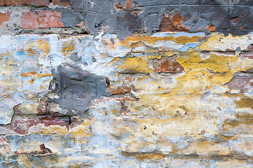 Old weathered brick wall fragment. Vintage wall background. Retro Grunge Wall.