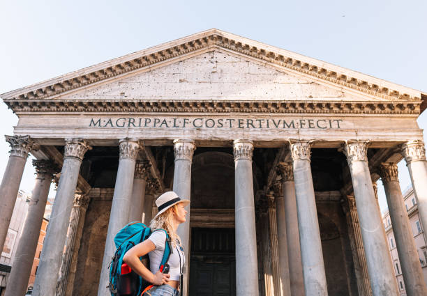 istock Young girl walks exploring the city with her backpack on a sunny day, digital nomad 1425267364