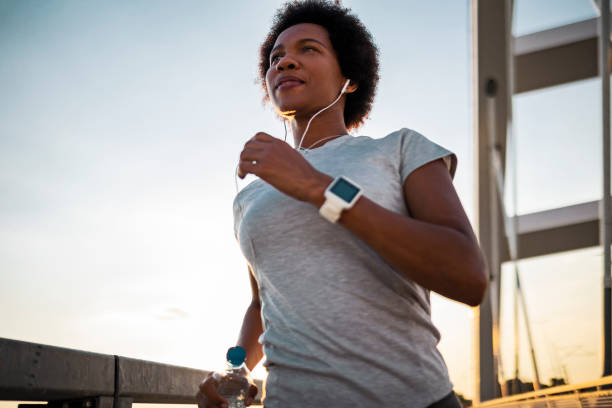 istock Woman running on the bridge 1425269758