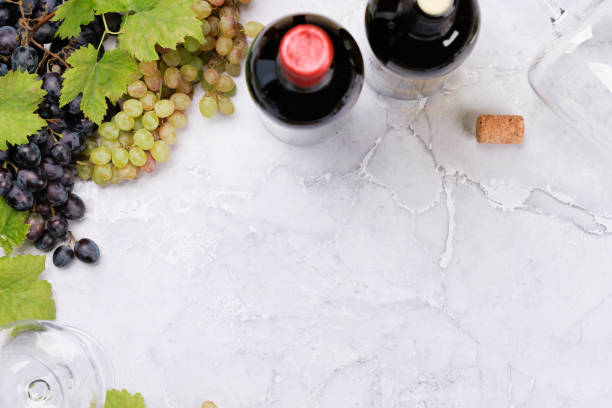 istock White, rose and red wine bottles and glasses 1425271467