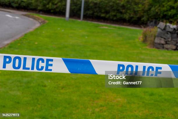 Police Tape At Roadside Stock Photo - Download Image Now - Accidents and Disasters, Barricade, Barricade Tape