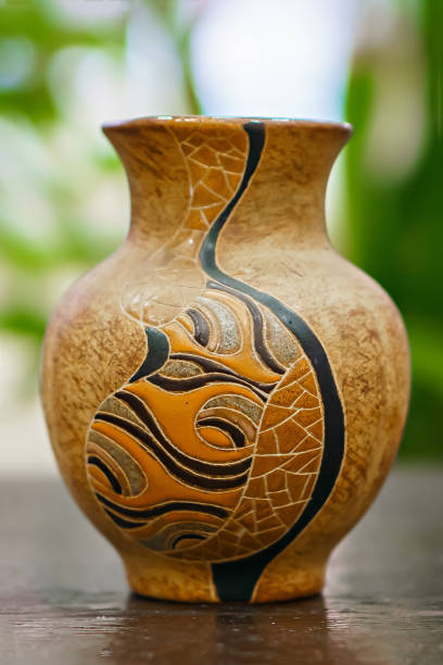 istock Old vintage antique jug with pattern on the table. Vintage style. Vessel for water 1425278331