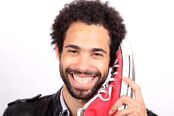 istock fashion man is holding a shoe 142527861