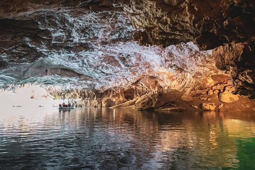 Group of people boating through the Altınbeşik golden cradle cave, located in the city of Antalya in Turkey ,Akseki,İbradı