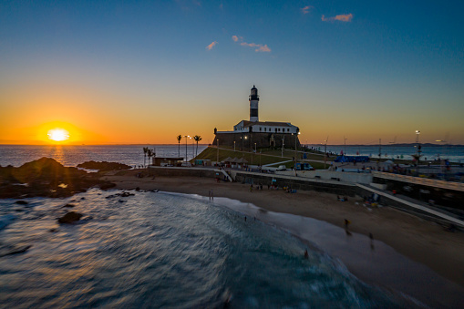Landscape of the sunset with Farol da Barra on a sunny day in Salvador, Bahia