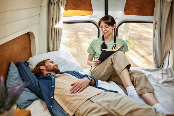 istock Couple resting together for reading book 1425281922