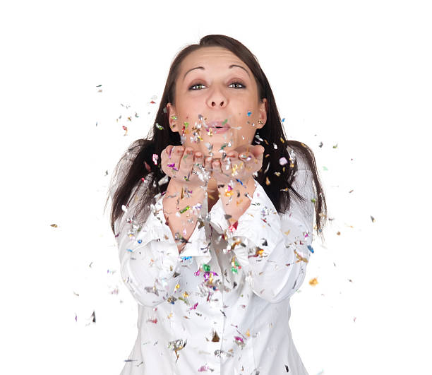 istock young woman blowing confetti 142528325