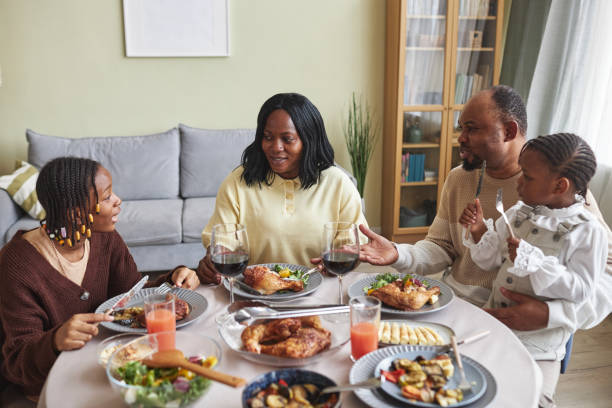 istock African family talking during dinner at home 1425283746