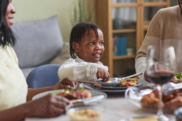 istock Little girl having dinner with family 1425283802