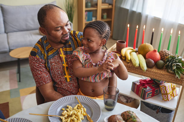 istock Dad talking to his little daughter at dinner 1425283910